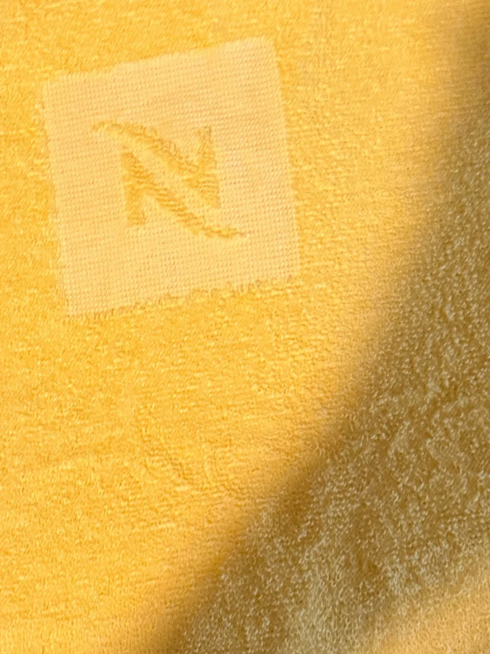 Nespresso Yuzu beach towel featuring a subtle 